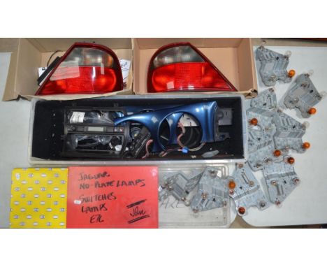 Collection of Jaguar X300 spare parts including rear light clusters (good condition but some scratches on cover, possibly use