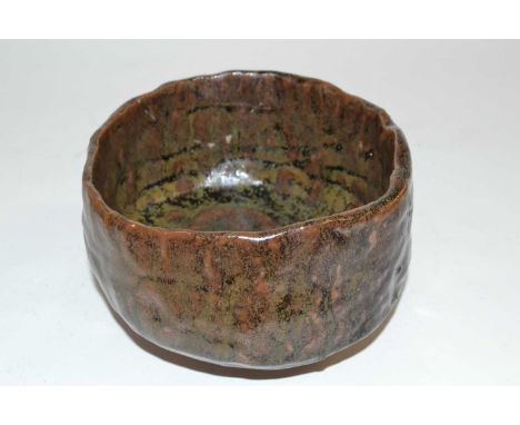 Wooden box containing a Japanese studio pottery bowl in brown glazes, the box with calligraphy and seal mark, the bowl 12cm d