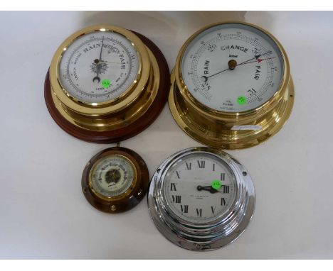 Group of two brass barometers, one on a wooden base, together with an 8-day clock, the dial marked 'Capt O M Watts Ltd, Londo