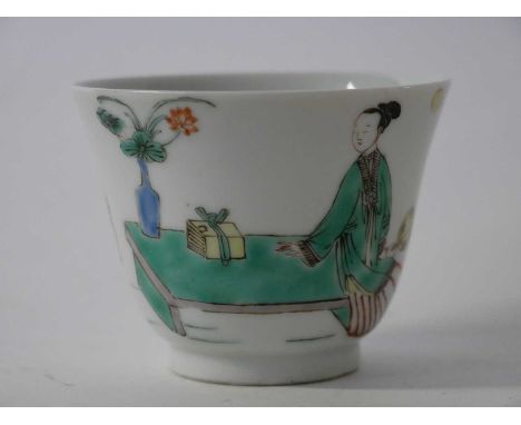 Chinese porcelain wine cup decorated in famille vert style with a lady by a table, containing precious objects, with calligra