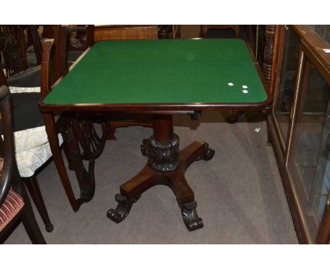 19th century mahogany card table with folding revolving baize lined top over a turned column, platform base and four scrolled