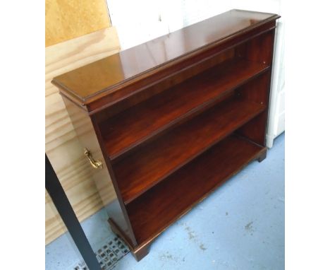 BOOKCASE, in mahogany finish, with two drawers below, on bracket supports and brass side handles, 107cm x 29cm x 93cm H (with