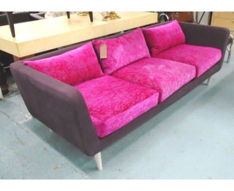 SOFA, three seater, by Designer Guild in purple fabric with pink/fushia patterned cushions on turned supports, 237cm L.