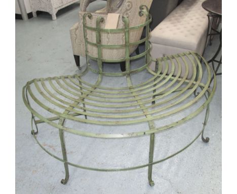 GARDEN TREE BENCH, in a distressed green metal finish, 147cm L. 