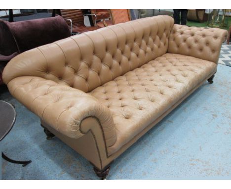 CHESTERFIELD SOFA, Victorian mahogany in pale tan deep button leather on turned supports and castors, 87cm x 89cm H x 254cm L