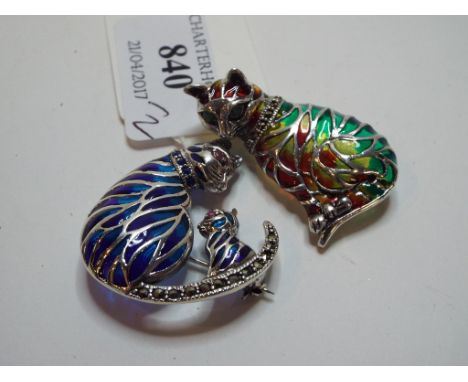 A silver coloured metal and plique-à-jour enamel brooch, in the form of a cat, and another similar (2) 
