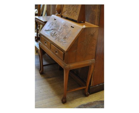 A Chinese carved hardwood bureau, 92 cm wide, and other matching items, including a coffee table and a standard lamp (6)