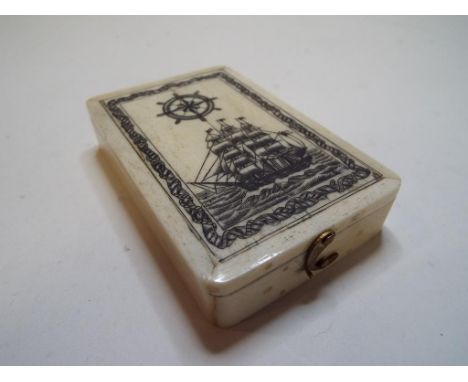 A compass, in a bone box decorated a ship, 6 x 9.5 cm