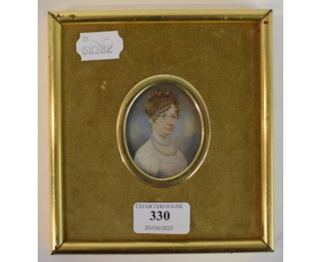 An oval bust portrait miniature, of a lady wearing a pearl necklace, watercolour, 6 x 5 cm