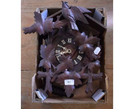 A Black Forest style carved wood cuckoo clock, 28 cm wide