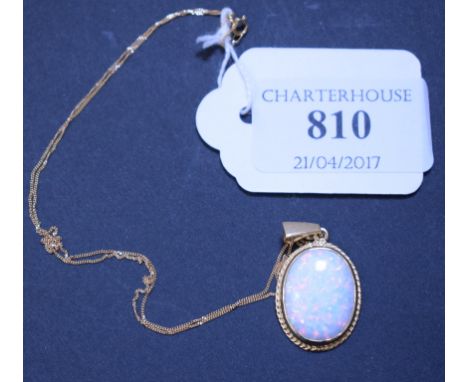 A 9ct gold and Gilson opal pendant, and a 9ct gold chain