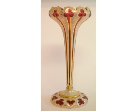 A late 19th century ruby glass lustre, overlaid with opaque glass, and decorated in gilt, small chip to top, lacks lustres, 3