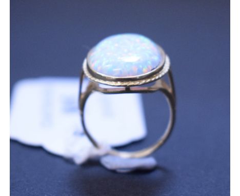 A 9ct gold and Gilson opal ring, approx. ring size O½