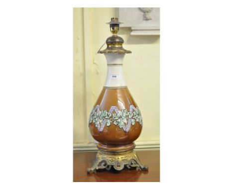 A brass mounted pottery lamp, 49 cm high (over fitment)