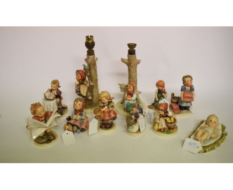 A Hummel lamp base, applied a girl and a kid, 228, 19 cm high (excluding fitment), another similar, and nine Hummel figures (