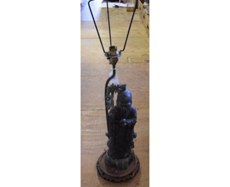 A carved soapstone figure, of a sage, 35 cm high, mounted on a lamp base