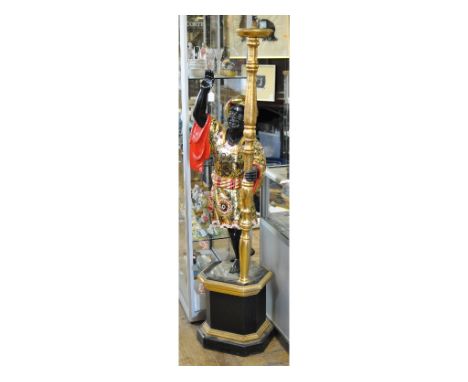 A carved wood Blackamoor figure, holding a lamp, on a base, 176 cm high   Condition report  Modern, some knocks