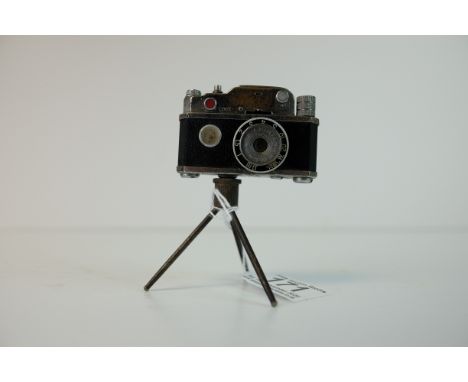 Early 20th century Novelty Table Lighter in the form of a Camera stood on a Tripod Base, 9.5cms high