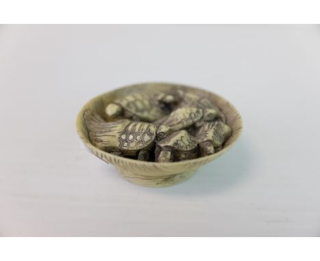 Faux Ivory Netsuke in the form of Turtles in a Basket, 5cms diameter