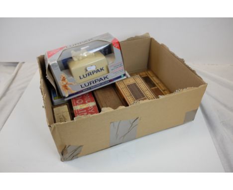 Games including Two Wooden Cribbage Boards, Ebony and Brass Dominoes, Ivory and Ebony Dominoes, plus playing cards, and a Box