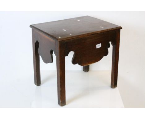 George III Mahogany Stool, the hinged lid opening to reveal a storage compartment, with shaped apron and raised on four squar