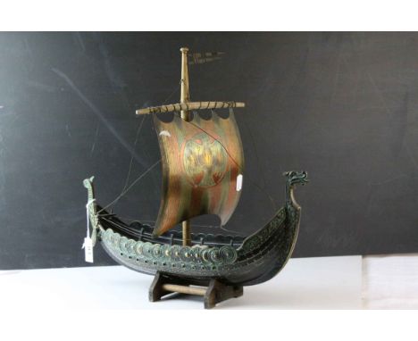Bronzed Metal Model of a Viking Boat held on a Wooden Stand, 43cms long, with makers mark for&nbsp;E Aagaard inc on rudder
