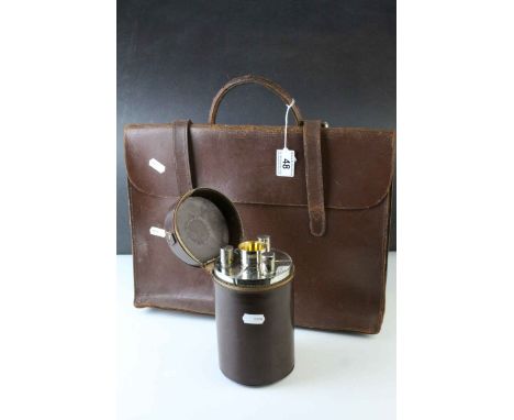 German made Three White Metal Curved Spirit / Hunting Flasks with Four Stacking Stirrup Cups with Gilt Linings, contained wit