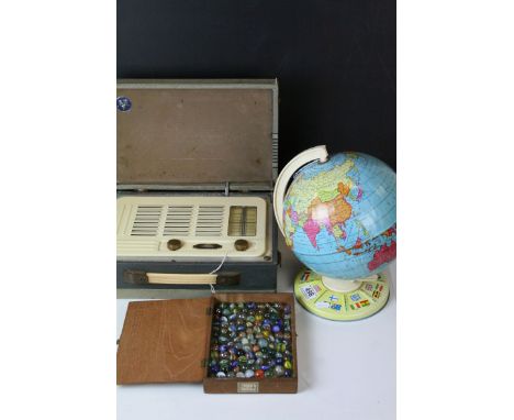 A  vintage tinplate globe a quantity of marbles, moneybox and a cased Vidor radio.