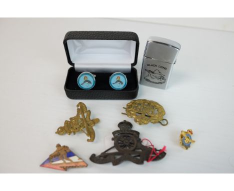 Two Royal Artillery Regiment Cap Badges, RAF Cap Badge, French Enamel Ski-ing Badge by Arthus Betrand, Paris and a Lighter by