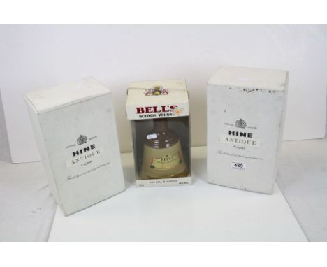 Two boxed and cased Hine Cognac Carafe decanter with contents together with two boxed Bells Whisky bells with contents.