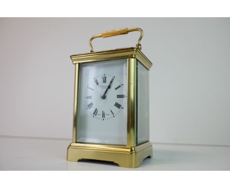 Late 19th / Early 20th century Gilt Brass Carriage Clock, the white enamel face with Roman numerals and marked J W Benson Ltd