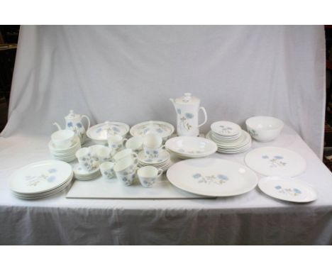 A comprehensive Wedgwood Ice Rose pattern dinner service  cups saucers meat plates veg dishes  coffee percu;ator etc. 