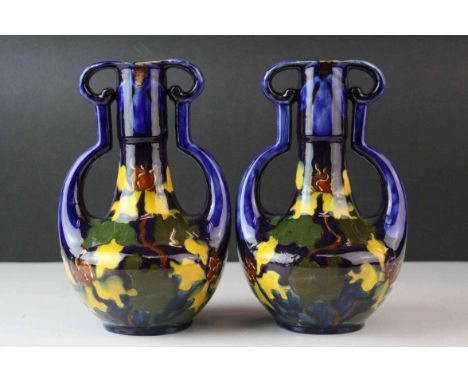 Pair of Art Nouveau Austrian Ceramic Twin Handled Vases, with a Mottled Green, Yellow and Brown Pattern on a Blue Ground, 20c