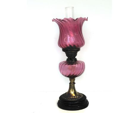 Early 20th century oil lamp with cranberry glass reservoir &amp; shade