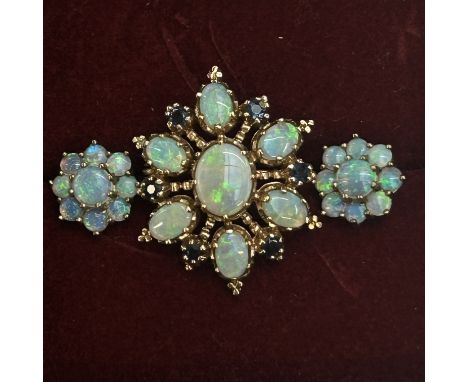 9ct Gold opal pendant/brooch with a pair of matching earrings. Brooch set with good quality sapphires. Brooch 28 mm x 25 mm