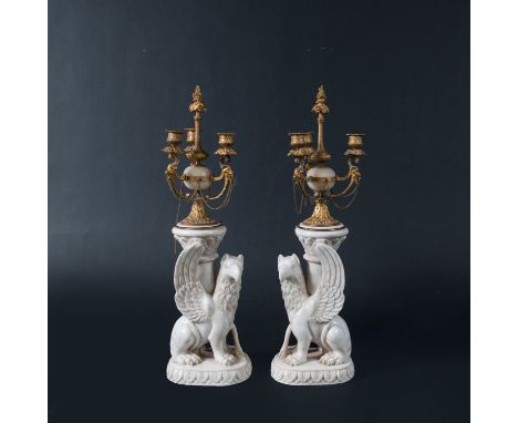 Pair of Classical Candelabras, sculpted marble Gryffons on round base, holding a column, with gilded bronze mounts with chain
