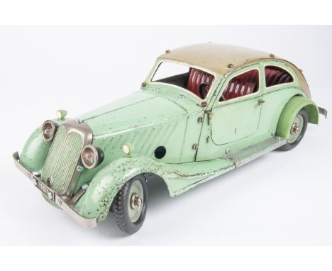 A Marklin clockwork Constructor Car. Bolt together panels in mint green with beige roof and red seats. Approx 380mm long. Gen