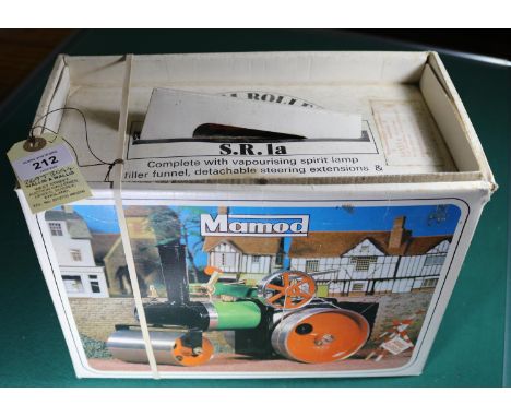 A Mamod live steam Road Roller in green, red and black. Boxed with accessories and inner card packing piece. Roller VGC-Mint.