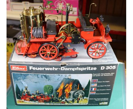 A Wilesco live steam Fire Engine (Feuerwehr Dampfspritze). D305, single cylinder, fuel pellet fired engine finished in red. W