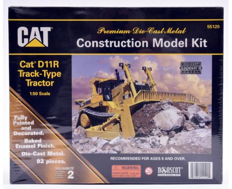 A Norscot CAT Construction Model Kit of a Cat D11R Track-Type Tractor. 1:50 scale. A metal fully painted and decorated kit, s