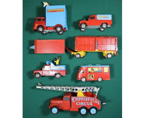 7x Corgi Chipperfields Circus vehicles. International 6x6 Crane Truck. Smith's Karrier van. Bedford Giraffe wagon. Land Rover