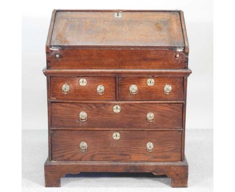 An 18th century oak bureau, of small proportions, in two parts, on bracket feet81w x 53d x 98h cm