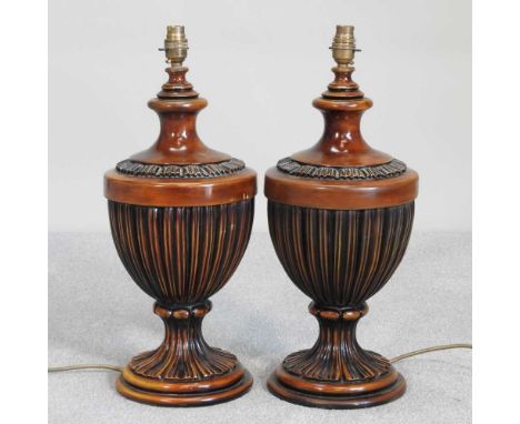 A pair of Regency style turned wooden table lamp bases, of urn shape, 51cm high (2)