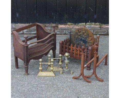 A cast iron fire grate, 46cm high, together with another and two pairs of fire dogs