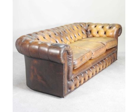 A brown upholstered button back chesterfield sofa215w x 92d x 73h cm