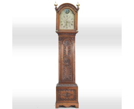 An 18th century and later carved oak cased longcase clock, the twelve inch arched silvered dial with an automaton ship, inscr