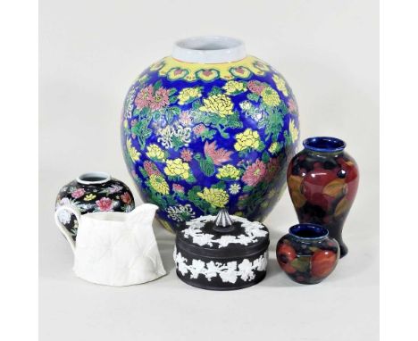A Moorcroft pottery vase, of baluster shape, decorated in the Pomegranate pattern, impressed marks and painted monogram, 16cm