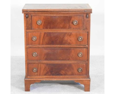 A reproduction mahogany bachelor's chest, on bracket feet62w x 36d x 78h cm
