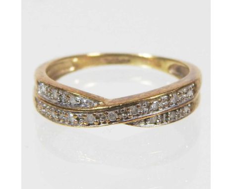 A 9 carat gold and diamond set ring, of crossover design, 2g, size M