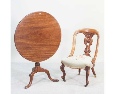 A 19th century mahogany tripod table, with a hinged circular top, together with a Victorian side chair, with a tapestry seat 